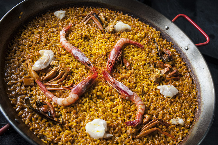 paella restaurante caceres habitat ciguena negra